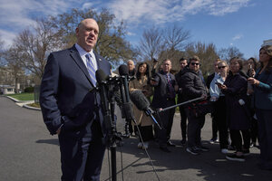 Tom Homan, in a blue suit, speaks with reporters outdoors at the White House.