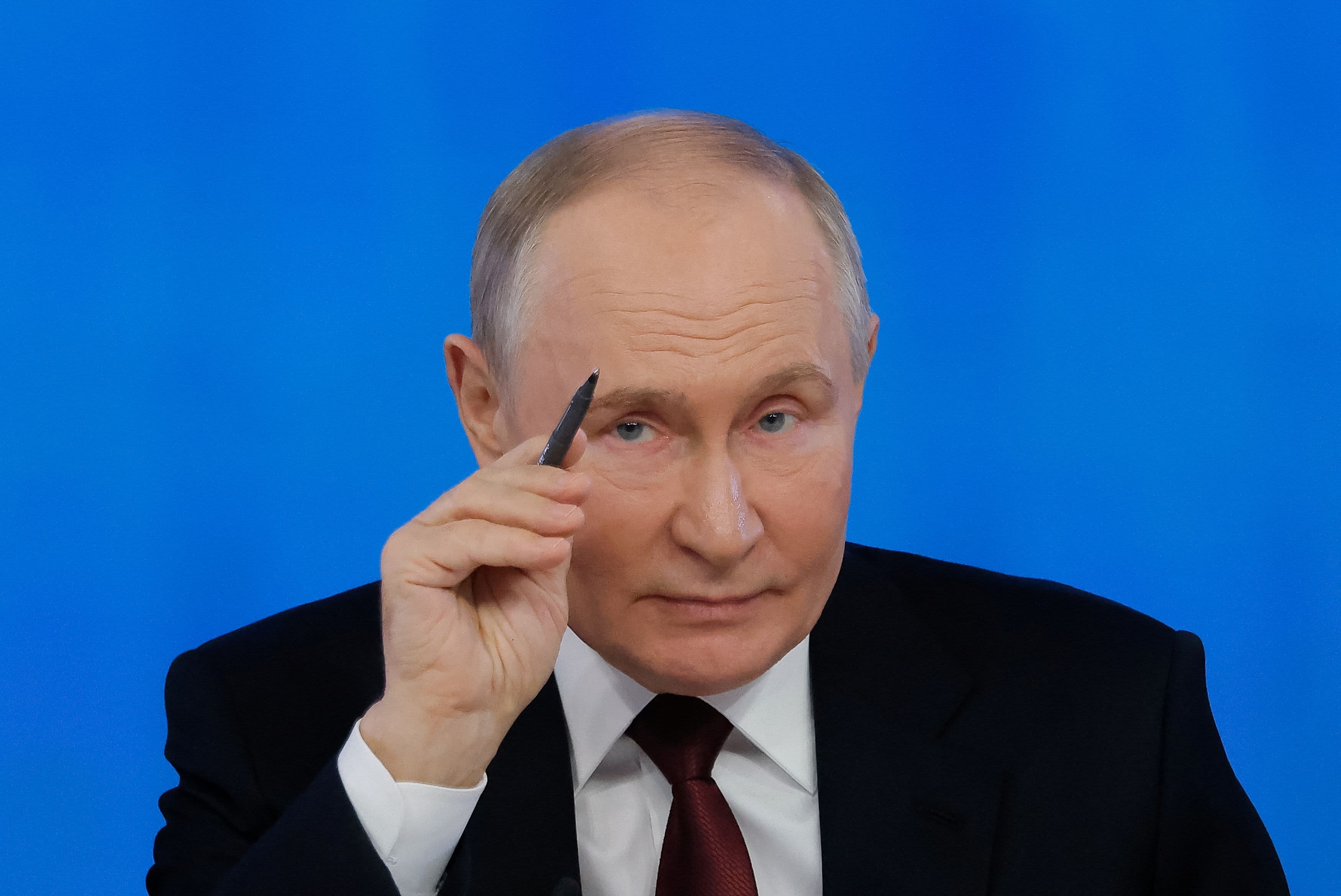 Russian President Vladimir Putin winks during his annual televised year-end press conference and phone-in held in Moscow, Russia December 19, 2024. 