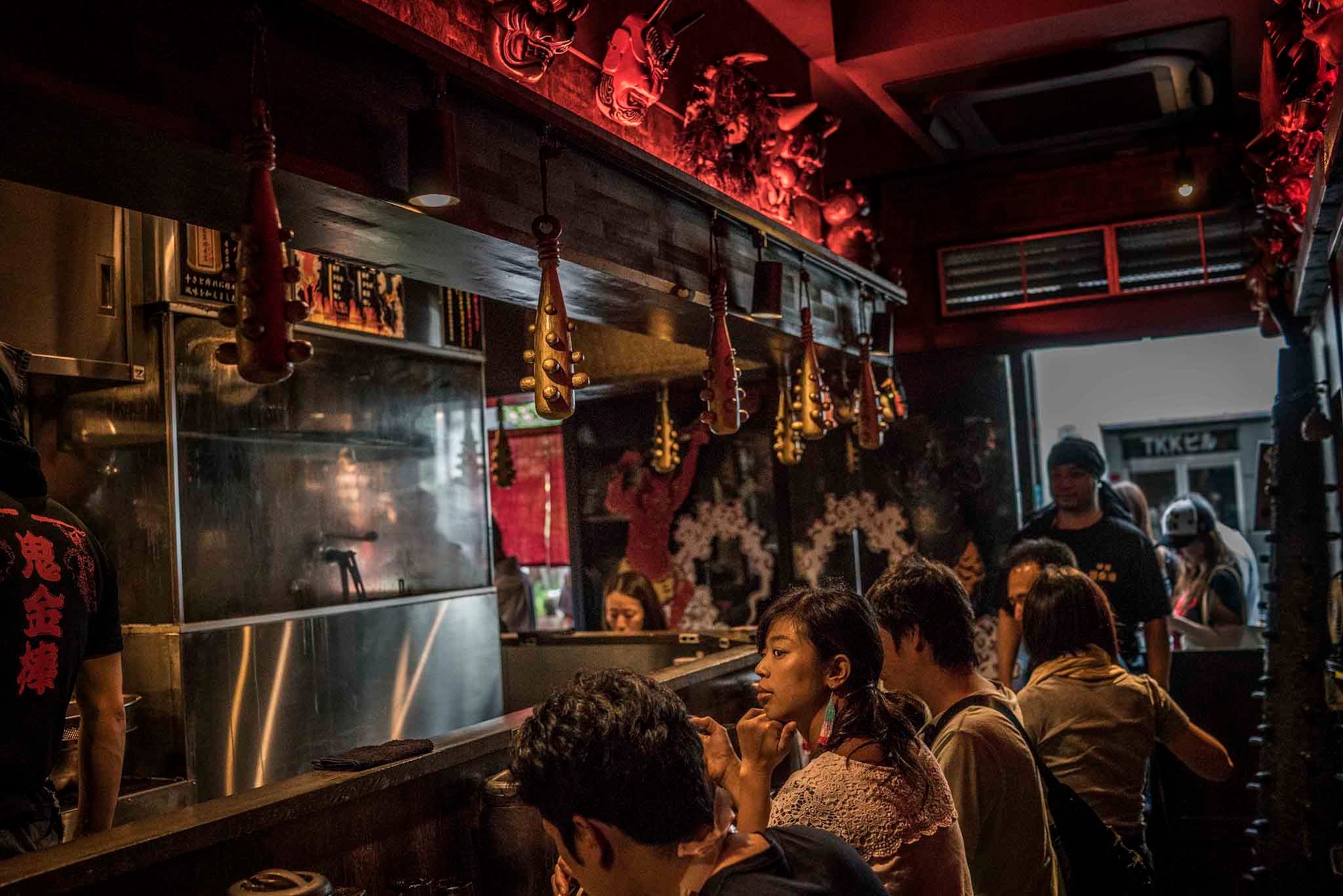 Full house at Kikanbo Miso Ramen in Kanda. Kikanbo is famous for its spicy ramen. Chefs use red pepper and Sichuan peppercorns for a numbing spice. Spice can be callibrated with the spicest served in a black bowl. The bats are