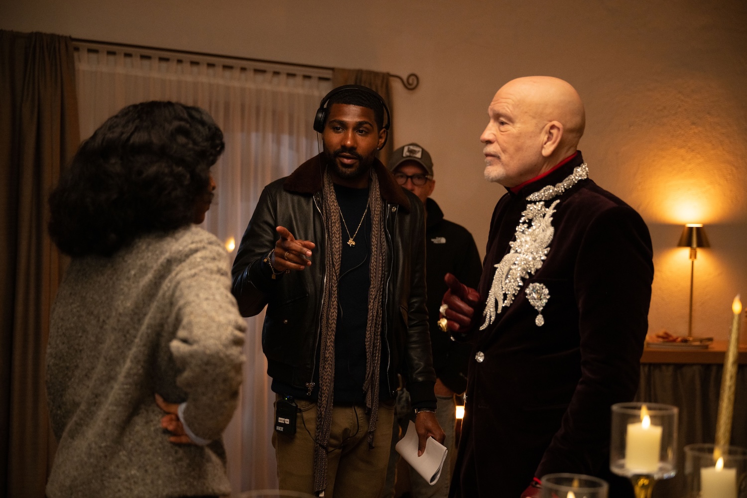 A director points to two actors.