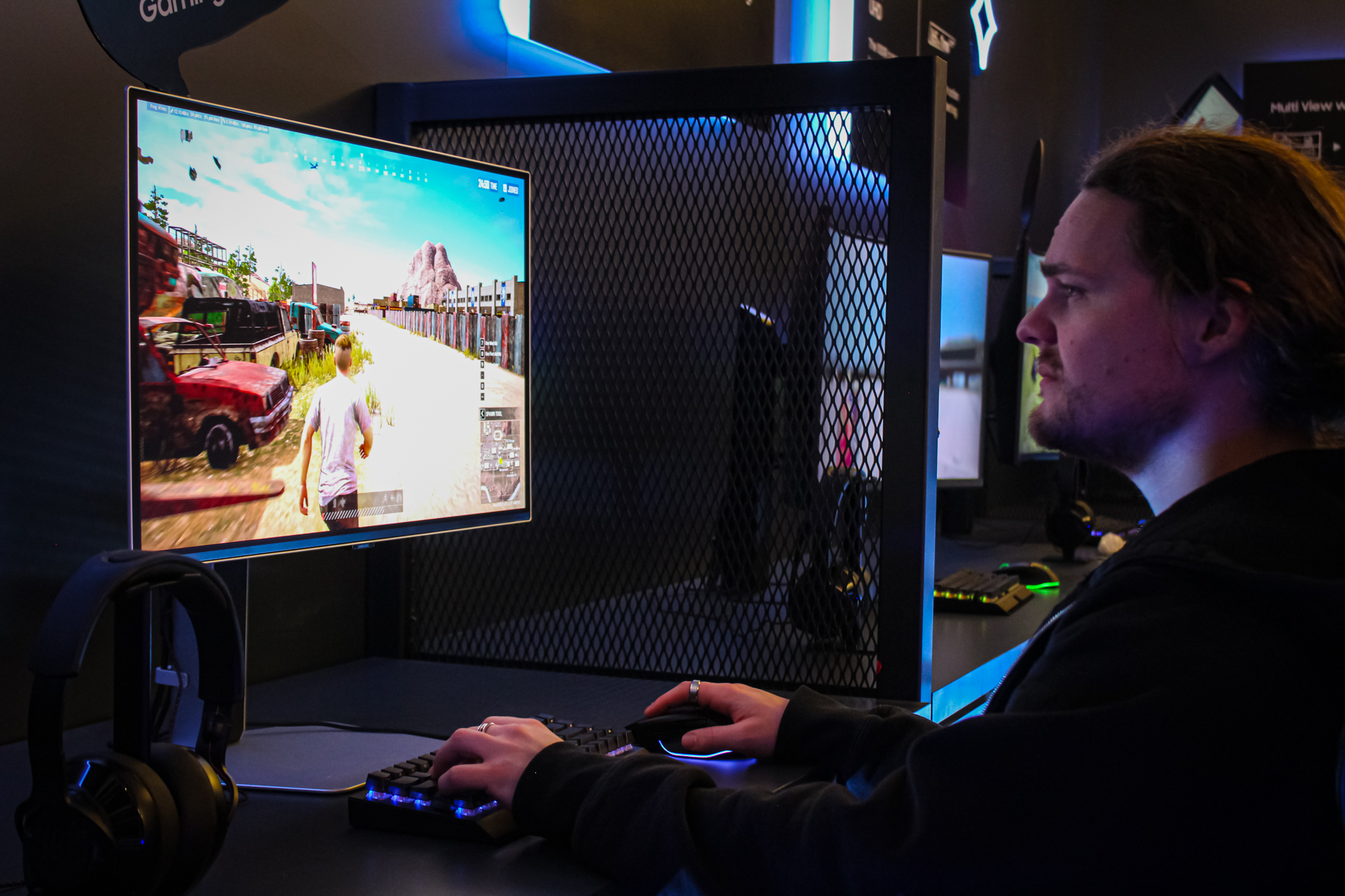 Someone playing the Samsung Odyssey OLED G6 gaming monitor.