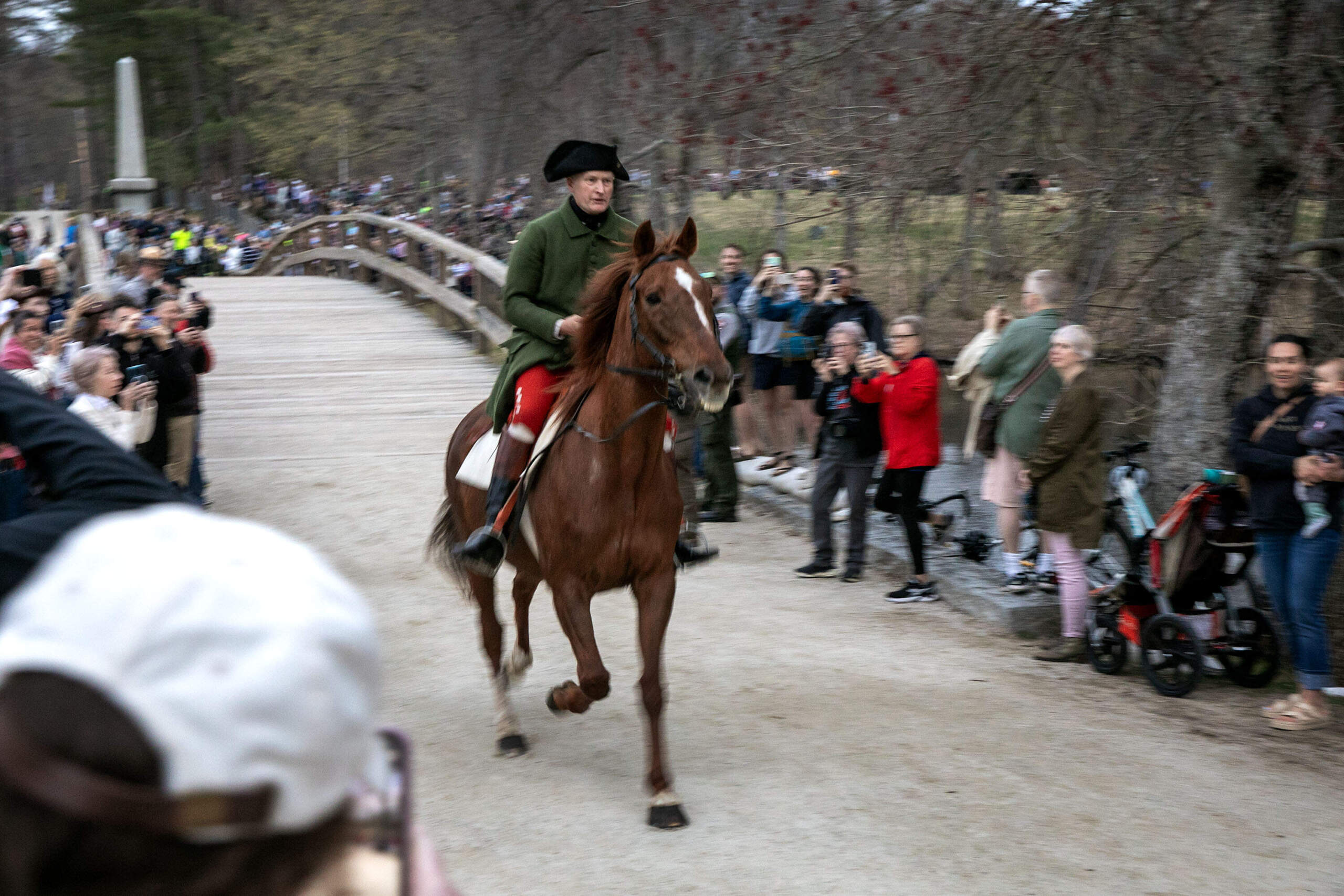 At 6 a.m. Dr. Samuel Prescott arrives from Monument Street and crosses The Old North Bridge to spread the word that British were on their way to Concord. (Robin Lubbock/WBUR)