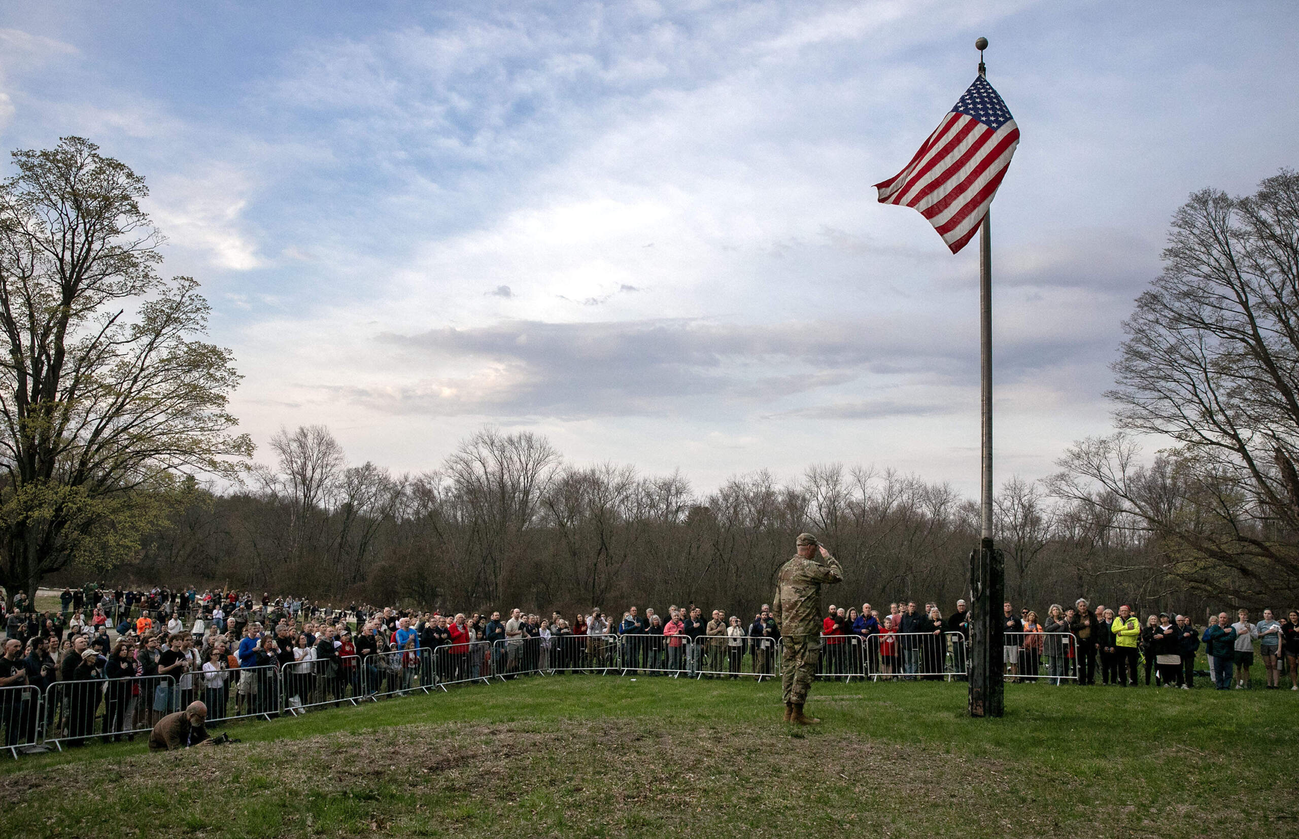 The dawn salute at Buttrick Hillside at the start of Concord's commemoration the 250th anniversary of the Battle of Concord. (Robin Lubbock/WBUR)