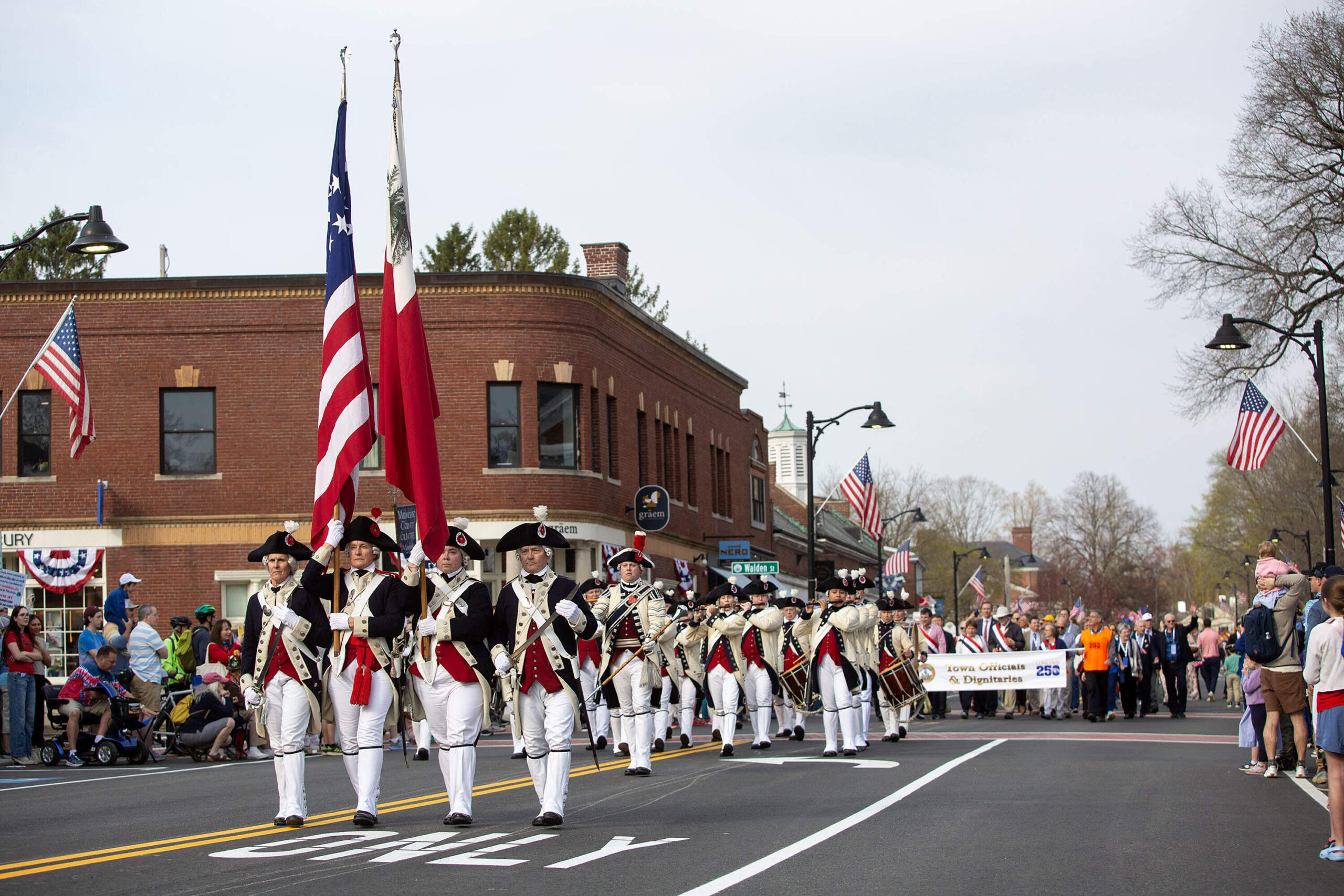 The Middlesex Country Volunteers march along Main Street in the parade for the 250th anniversary commemoration of the Battle of Concord. (Robin Lubbock/WBUR)