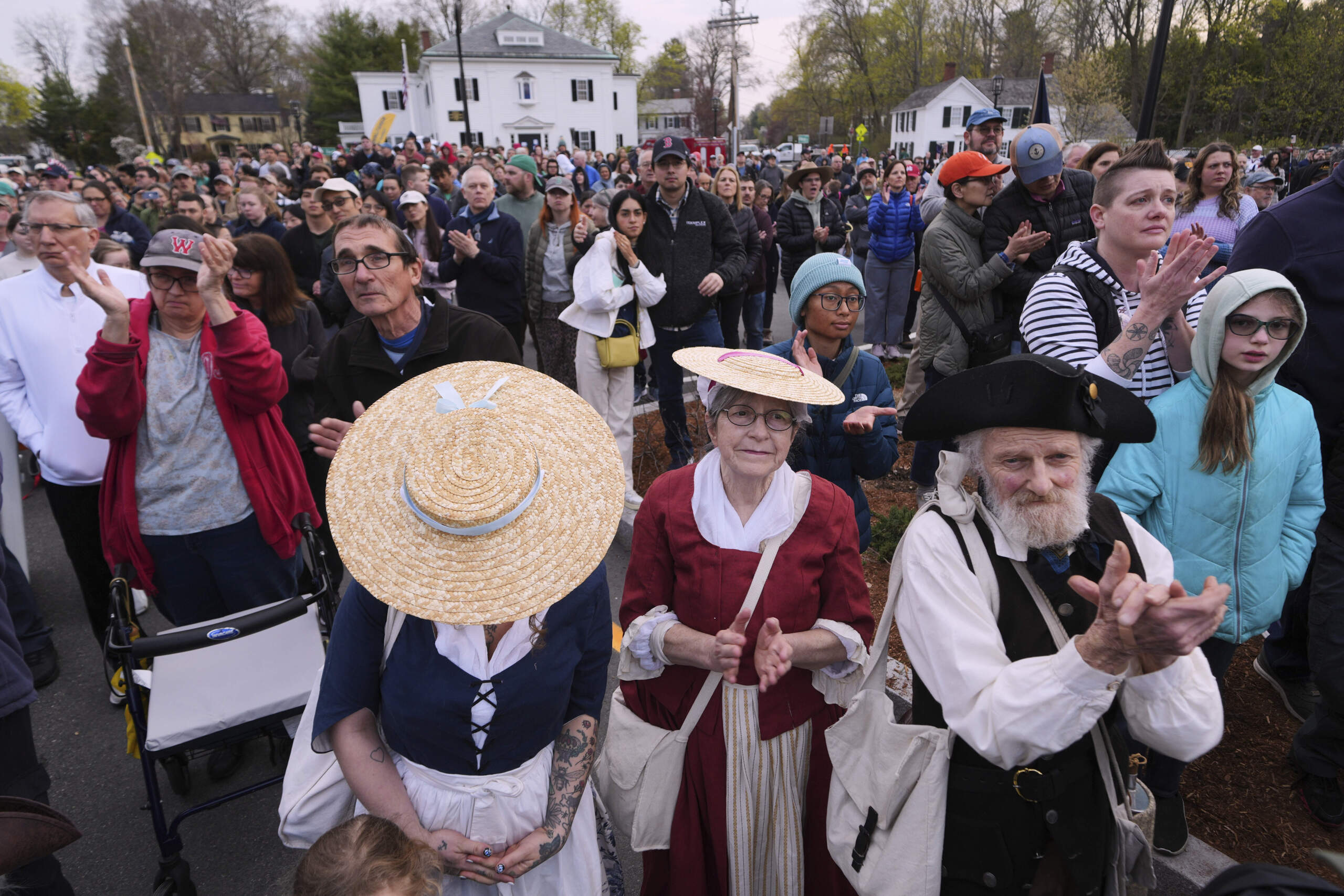 Thousands, some dressed in period clothing, watch the reenactment Saturday. (Charles Krupa/AP)