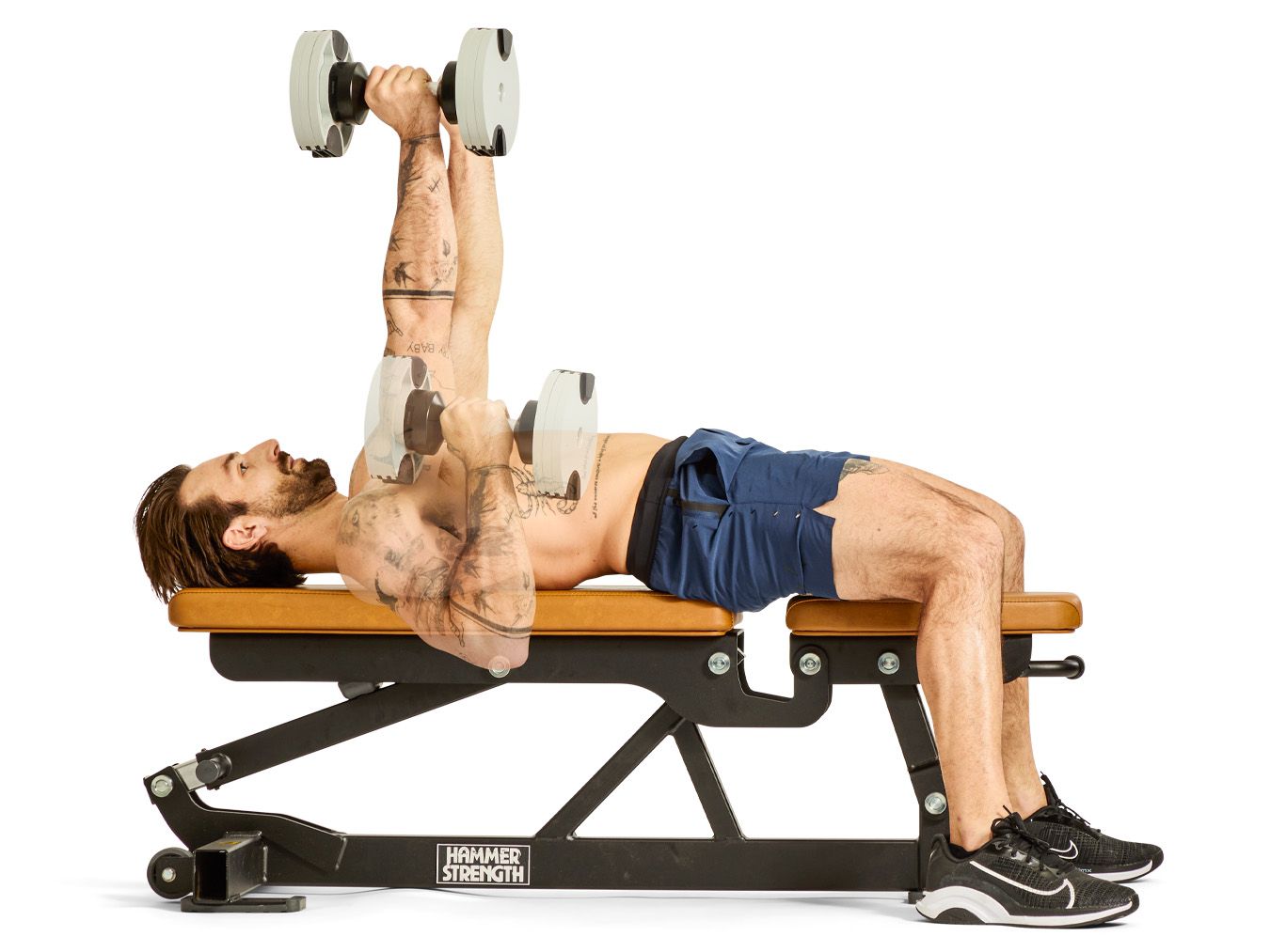 individual performing a dumbbell triceps extension on a weight bench