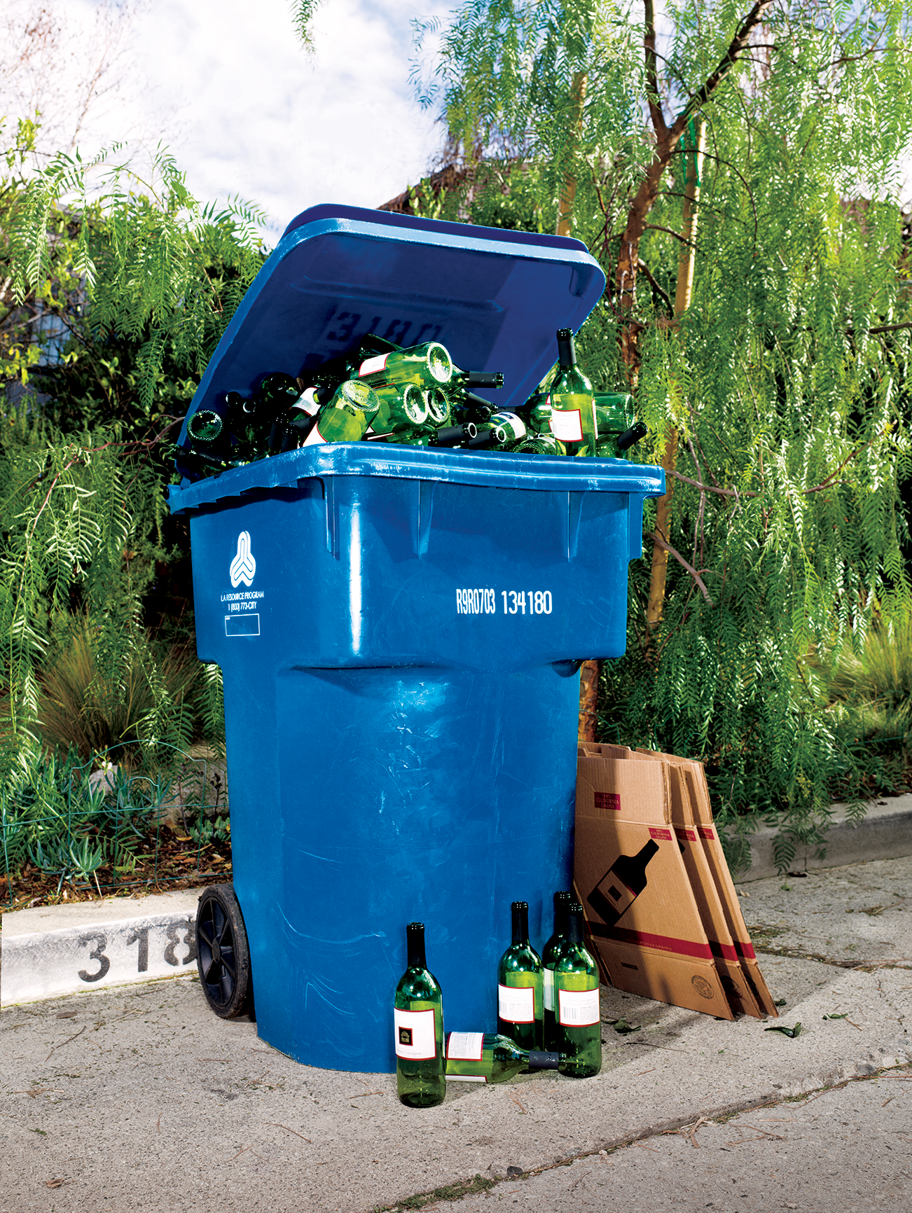 garbage can filled with beer bottles
