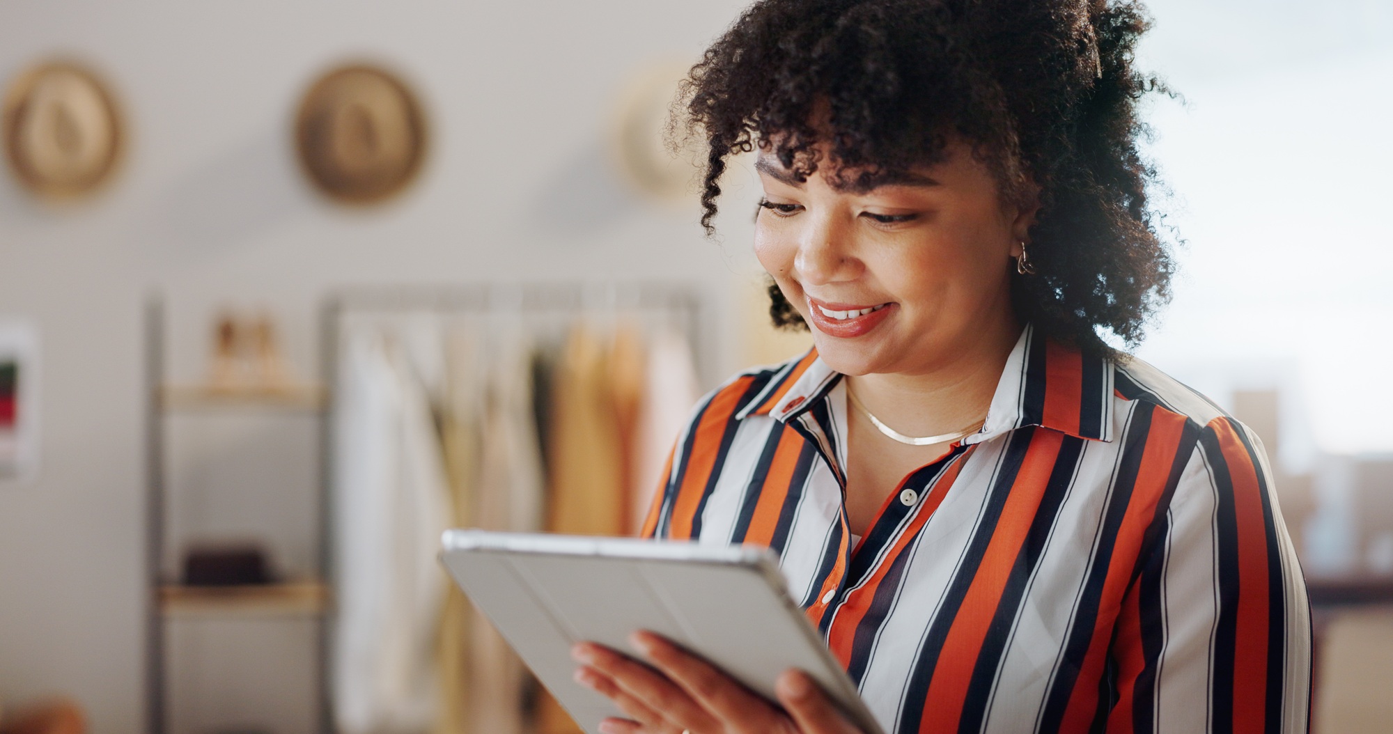 Startup, boxes and woman with a tablet, business and smile with connection, internet or delivery wi