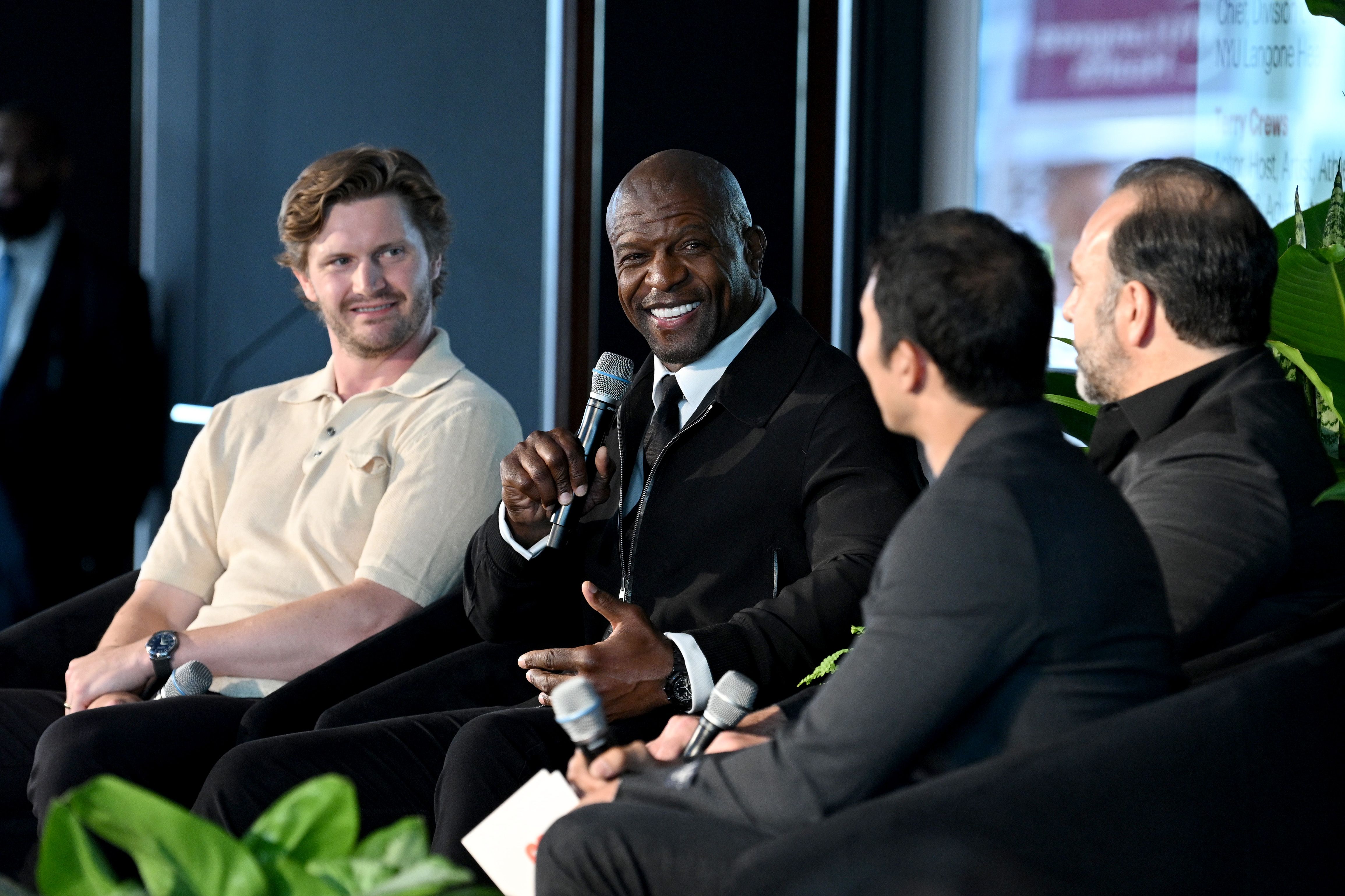 new york, new york june 12: (l r) jacob trouba, terry crews, laith jazrawi and ebenezer samuel speak onstage at the men’s health lab hosted by hearst magazines at hearst tower on june 12, 2025 in new york city. (photo by bryan bedder/getty images for hearst magazines)