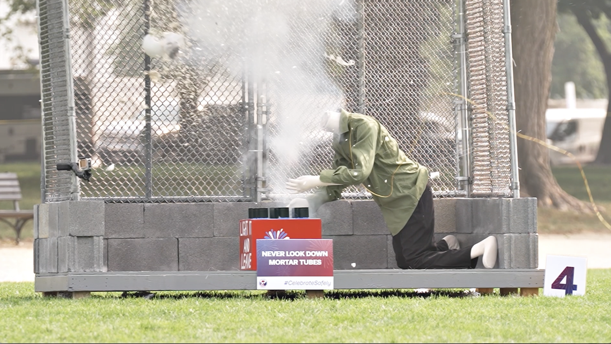 Video screenshot of mannequin getting head blown off by mortar round during firework safety demonstration