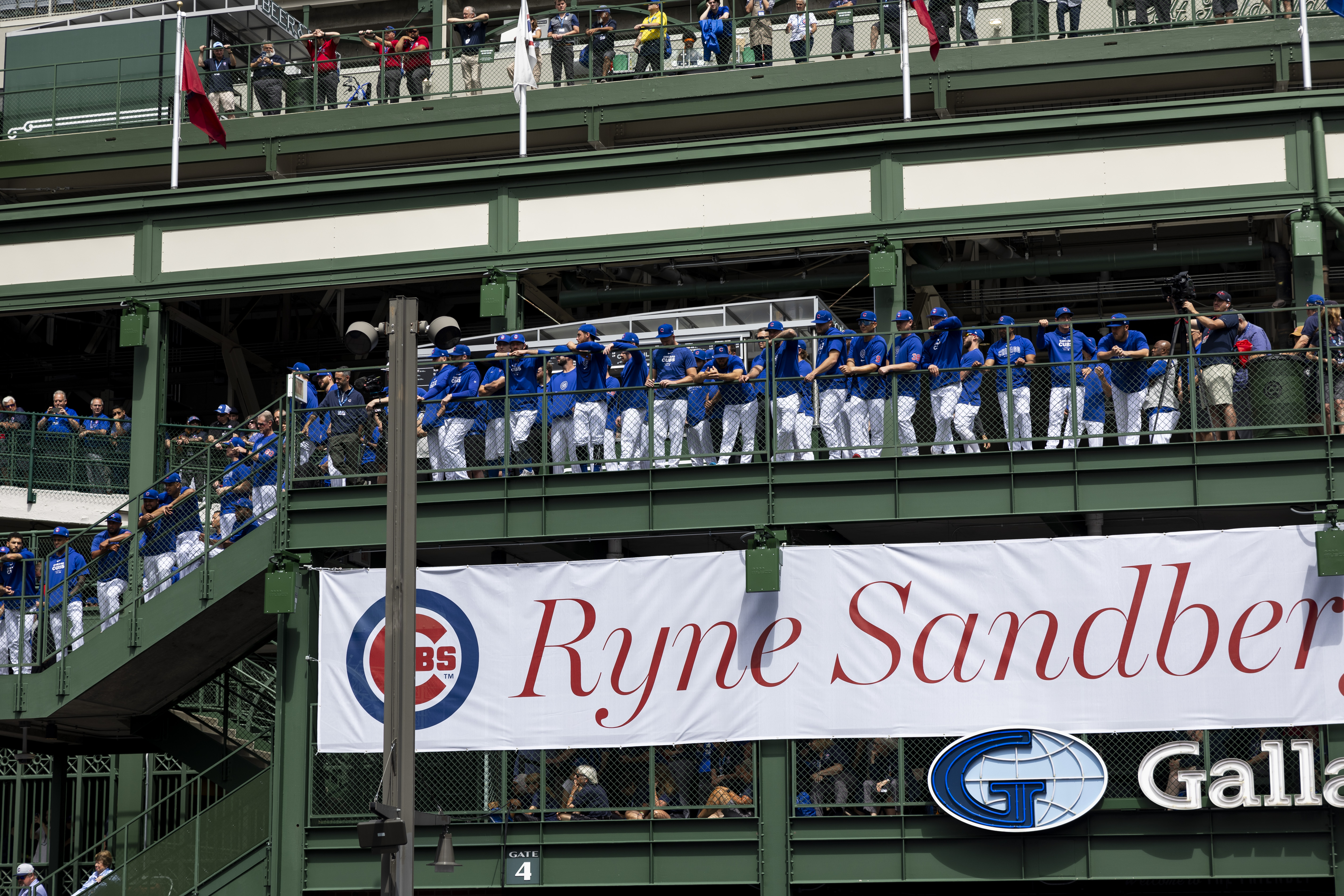 Cubs players attend a statue dedication ceremony for Ryne Sandberg outside Wrigley Field on June 23, 2024. (Armando L. Sanchez/Chicago Tribune)