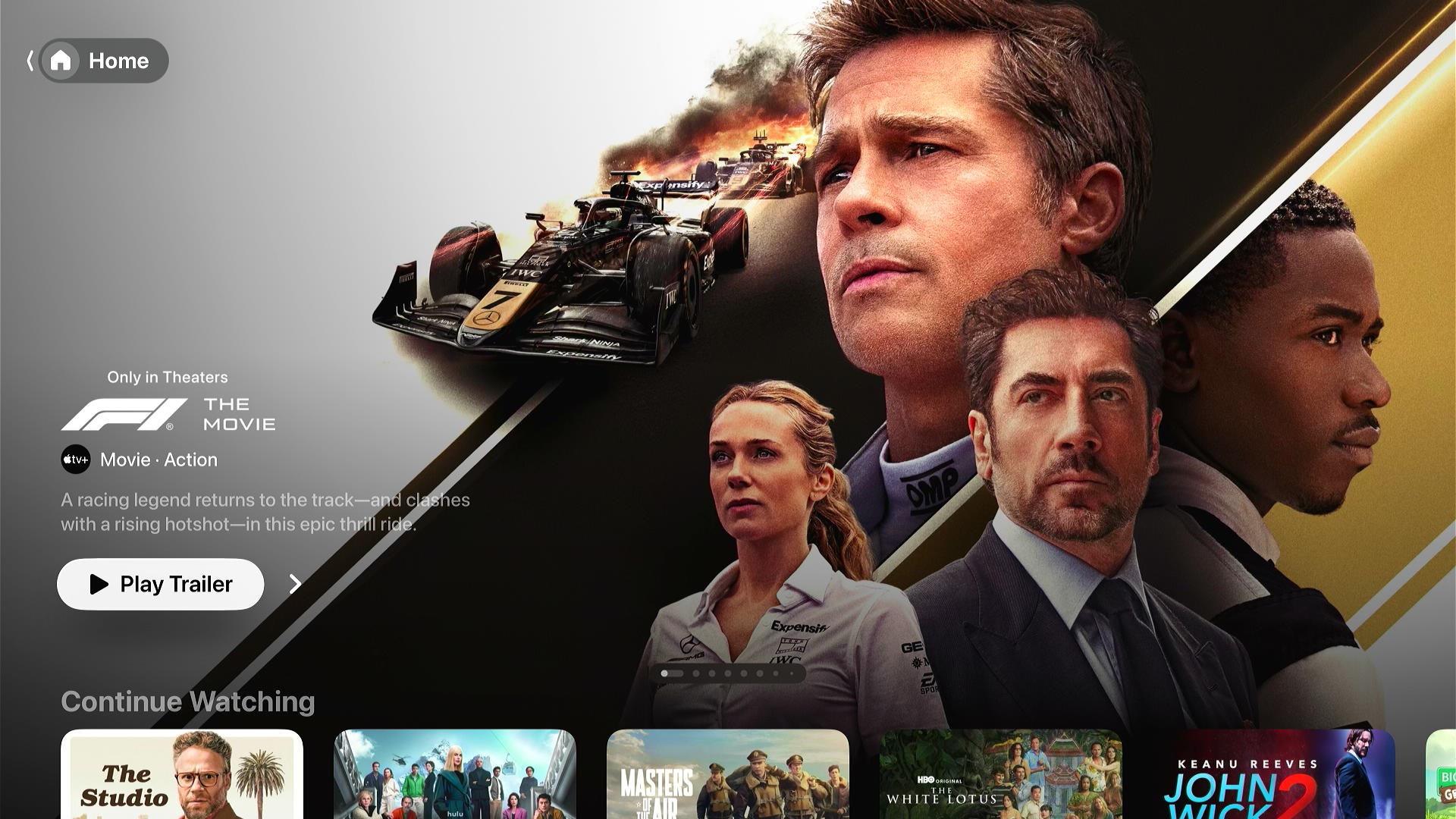 tvOS home screen with an F1 trailer at the top and new Liquid Glass design