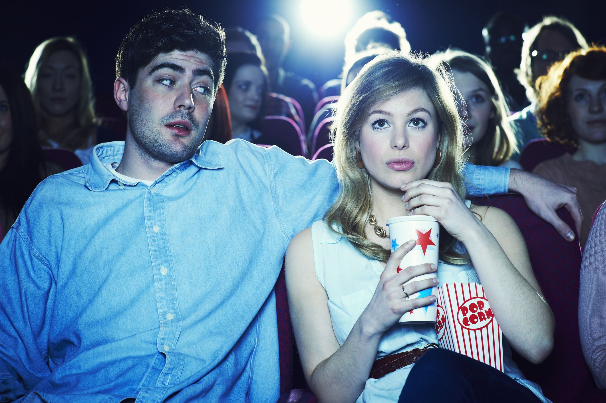 couple enjoying a movie at the cinema couple enjoying a movie at the cinema