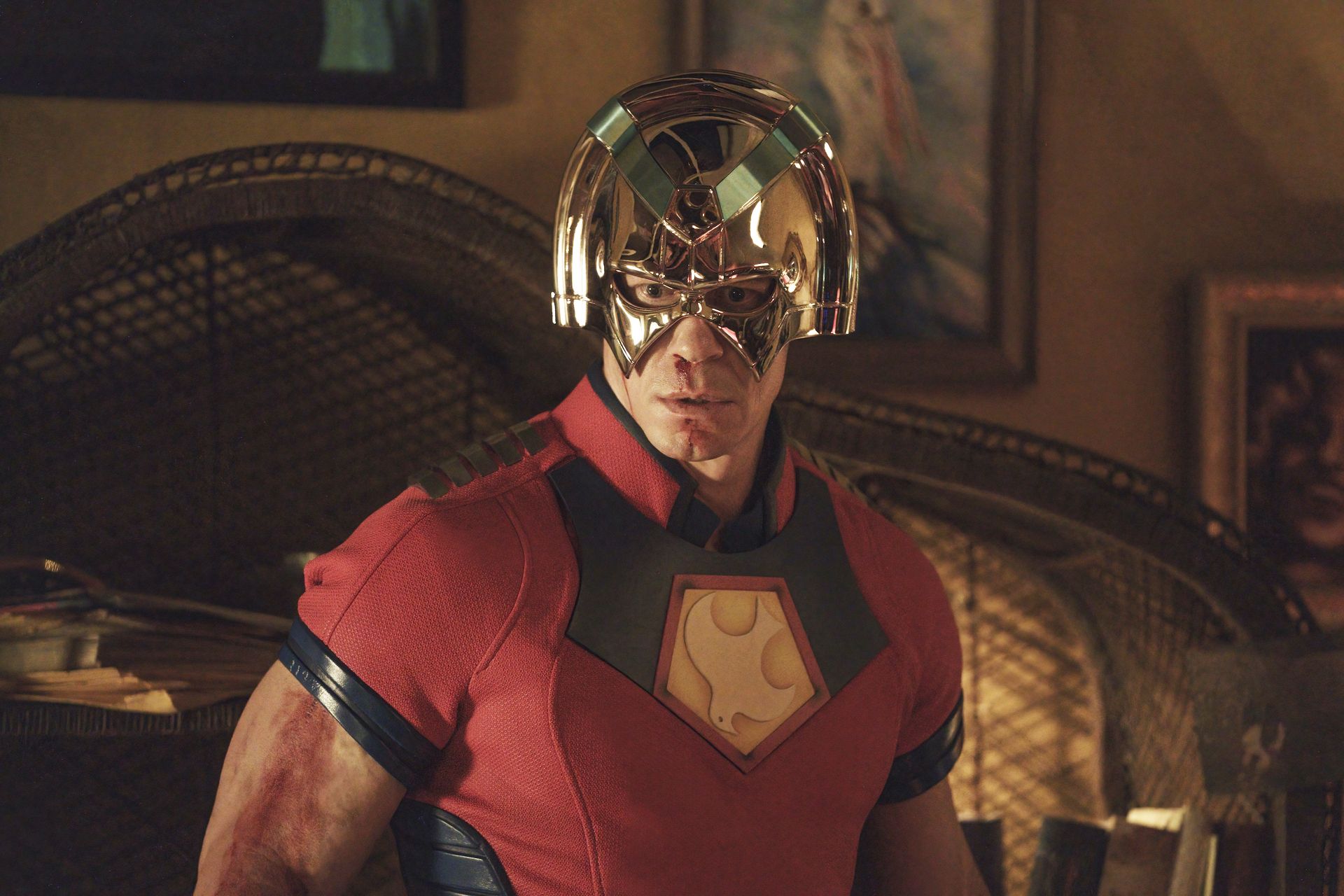a character in a colorful superhero costume with a unique helmet