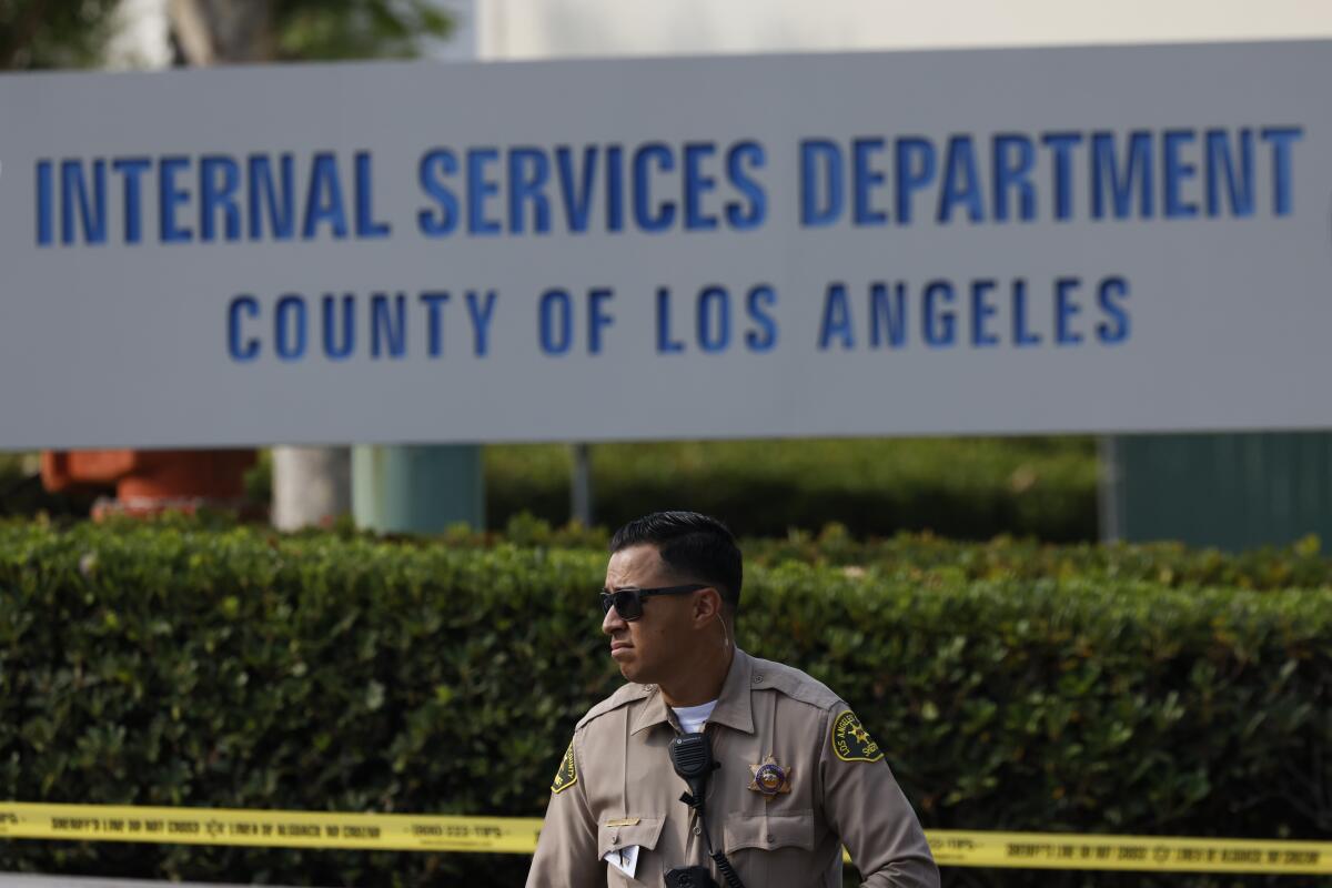 An L.A. County sheriff's deputy stands outside the Biscailuz Center Training Academy.