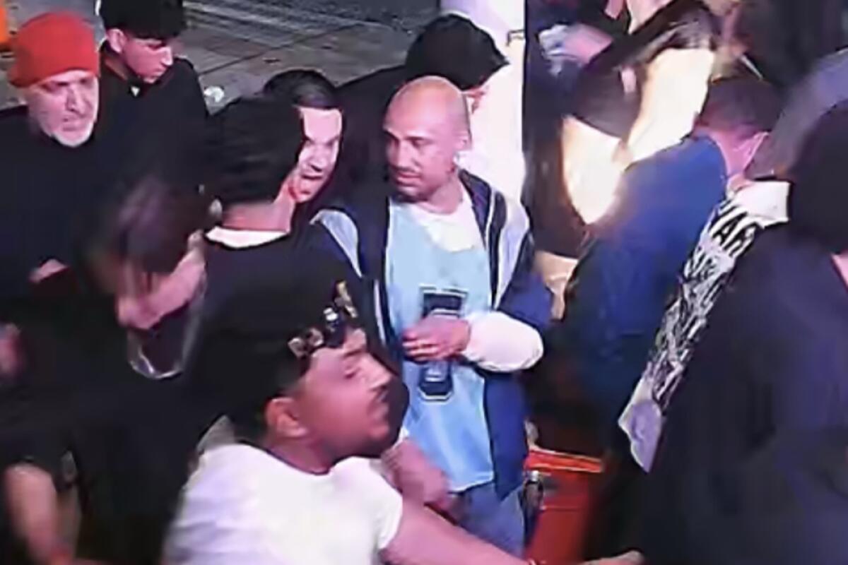 A man in a blue shirt with a number 5 on it.