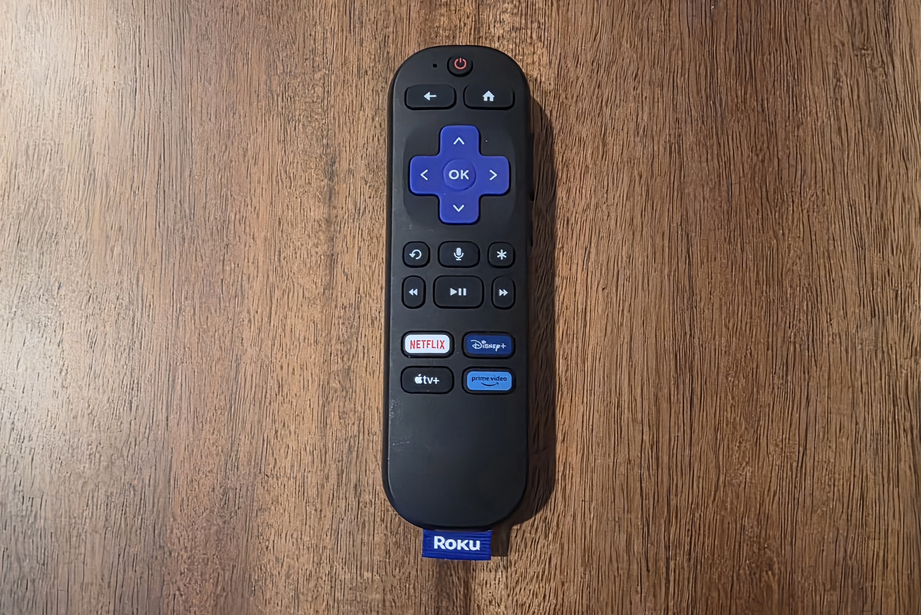 Roku Express remote with d-pad, playback controls, voice control, a power button, and app shortcuts