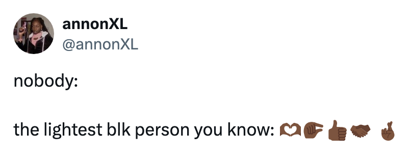Tweet joke about light-skinned Black person with heart, pointing, thumbs-up, and hand emojis
