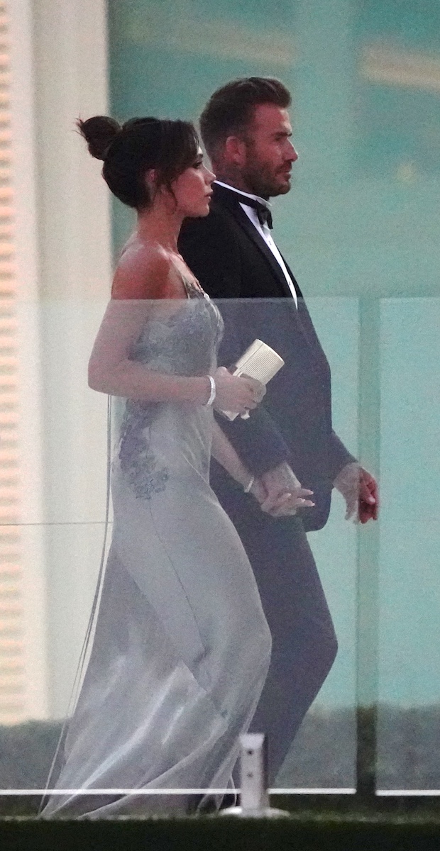 Victoria Beckham in a silver dress,David Beckham in a tuxedo.