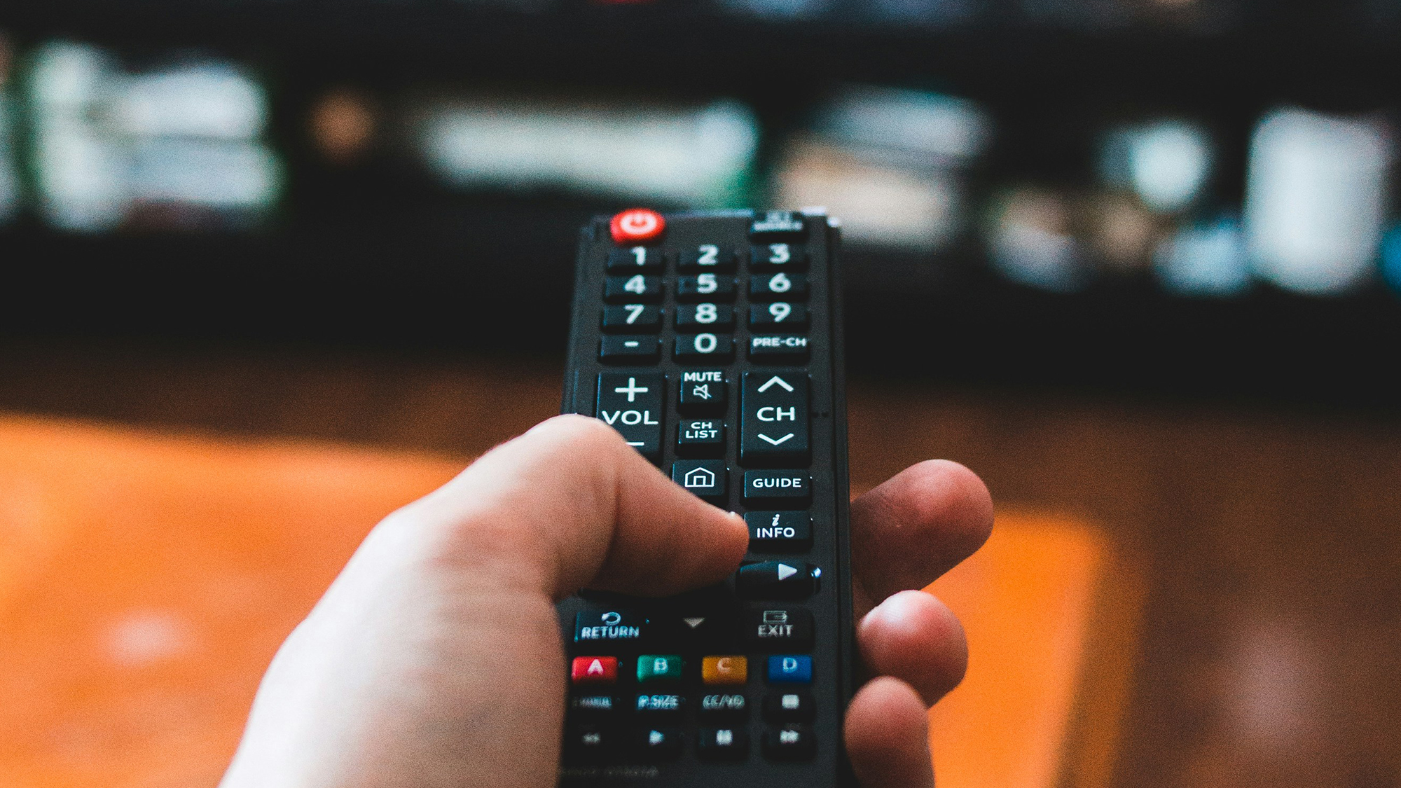 hand holding a tv remote