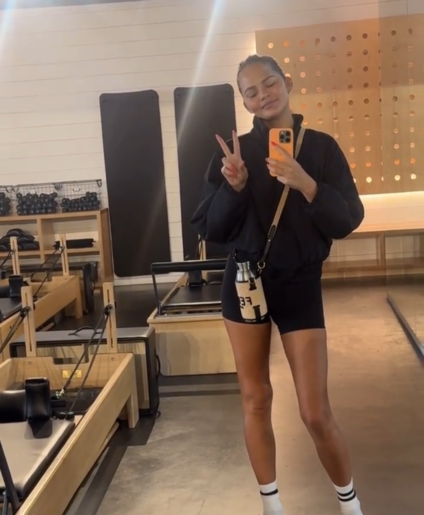 Chrissy Teigen in a mirror selfie.