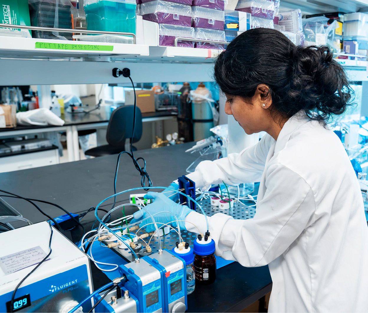 laboratory setup with scientific equipment and a researcher conducting experiments