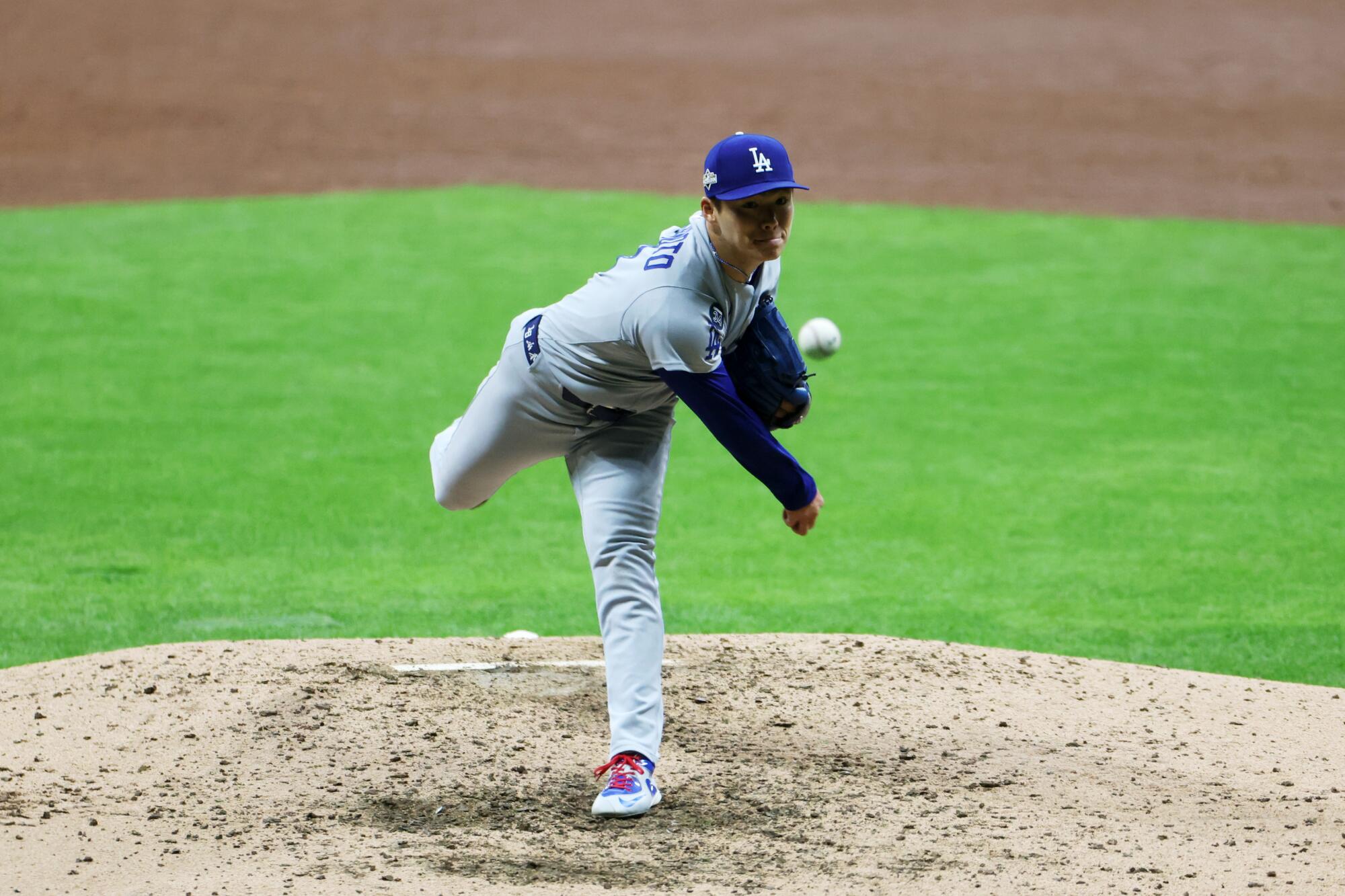 Dodgers pitcher Yoshinobu Yamamoto delivers against the Milwaukee Brewers in Game 2 of the NLCS on Tuesday.