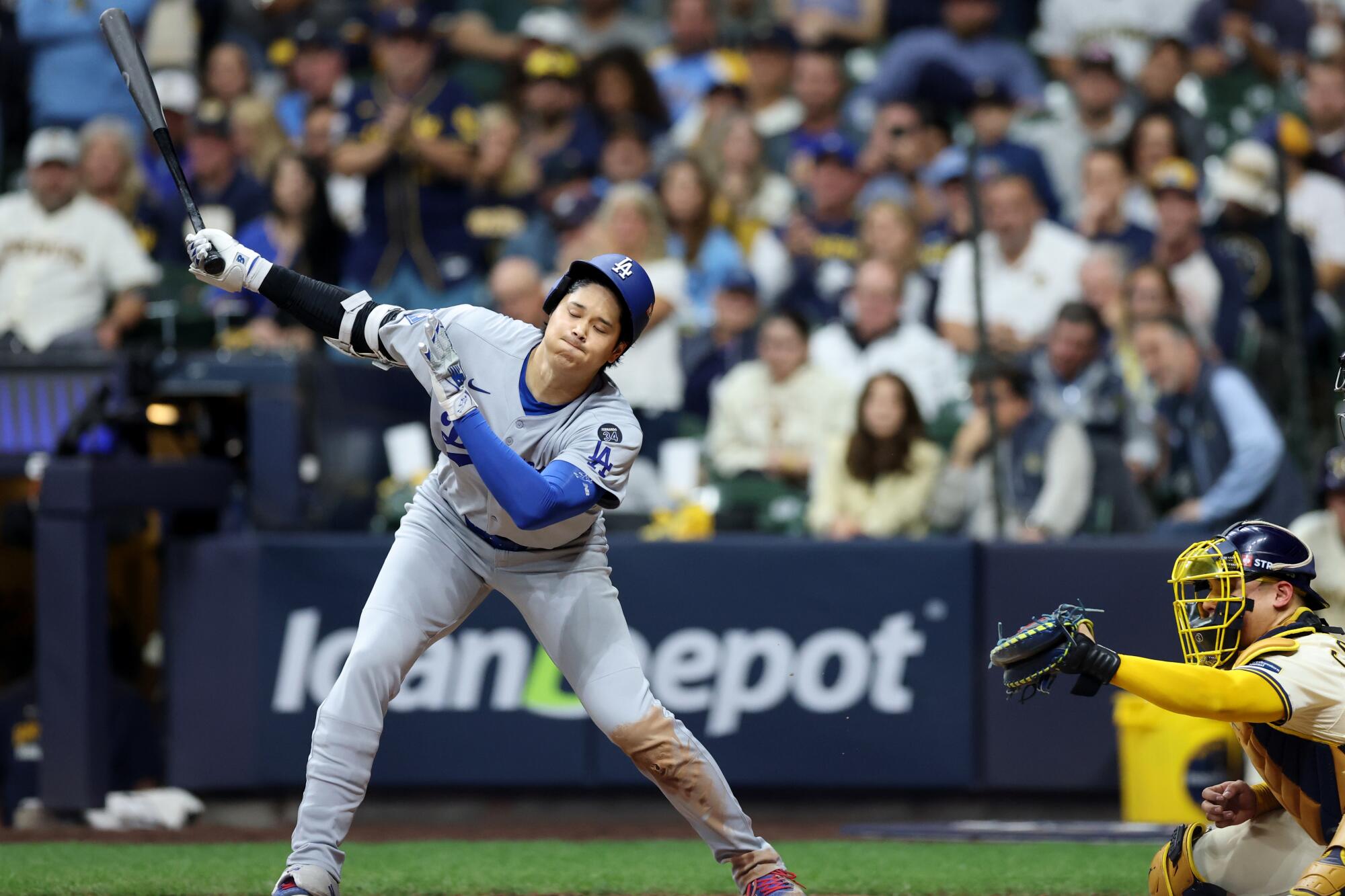 Dodgers star Shohei Ohtani strikes out with the bases loaded to end the eighth inning.