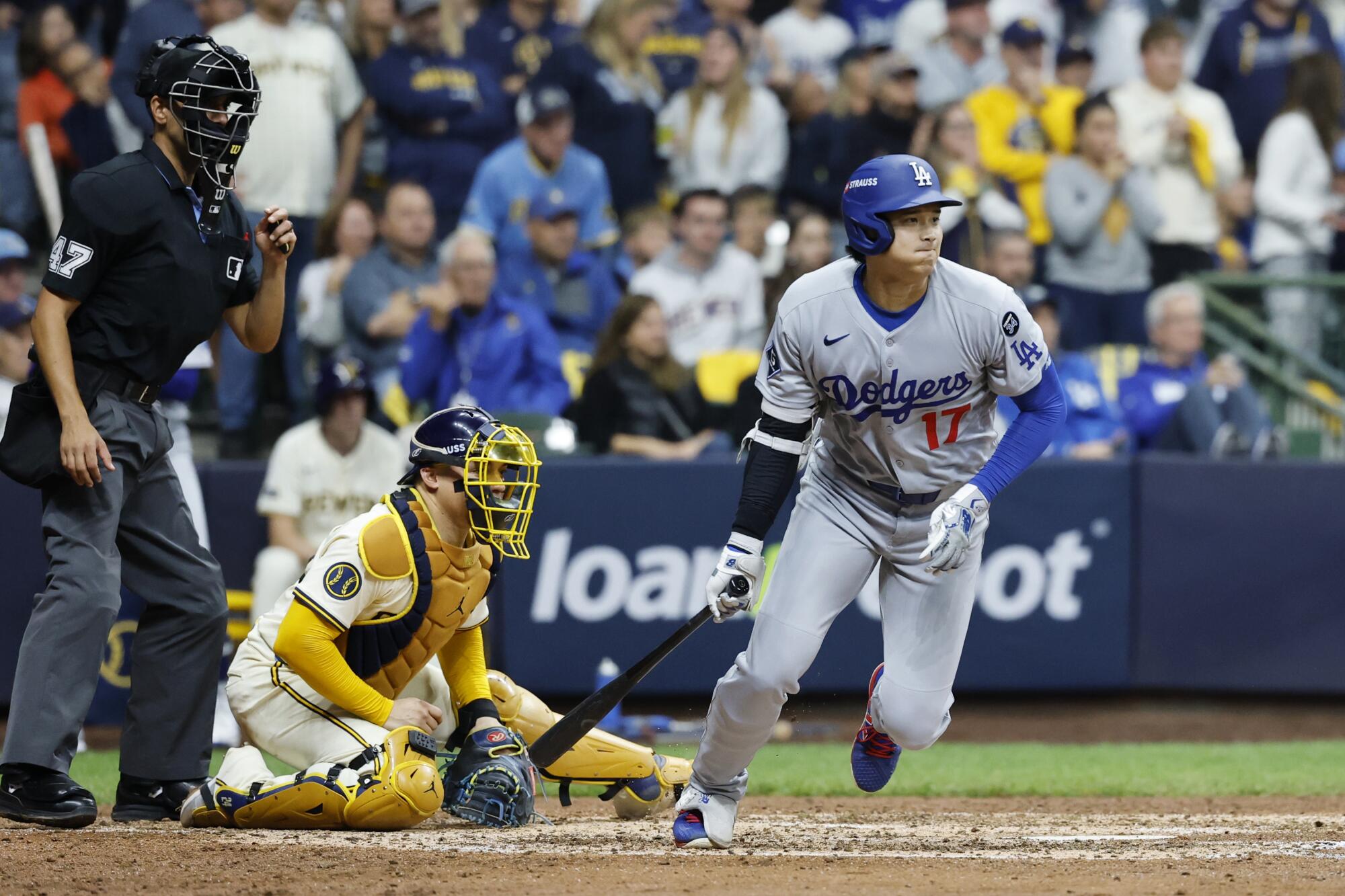 Shohei Ohtani hits a run-scoring single in the seventh inning for the Dodgers.