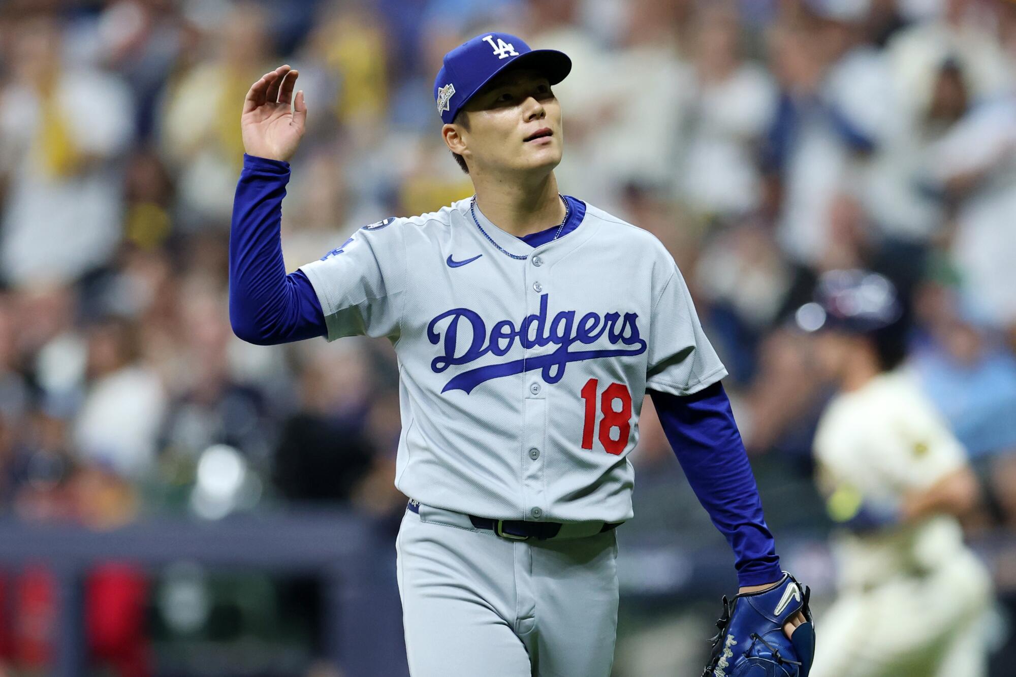 Dodgers pitcher Yoshinobu Yamamoto reacts after striking out Milwaukee's Caleb Durbin.
