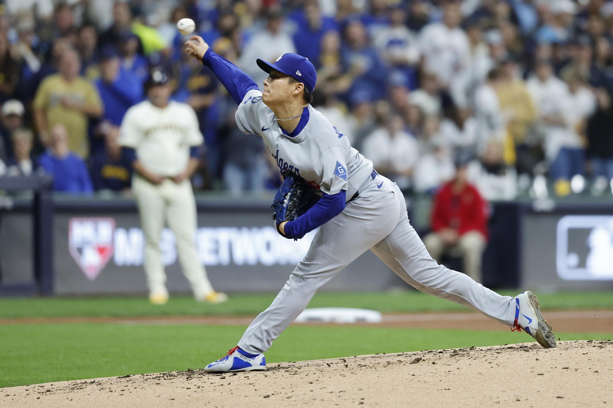Dodgers pitcher Yoshinobu Yamamoto delivers in the third inning of Game 2 of the NLCS.