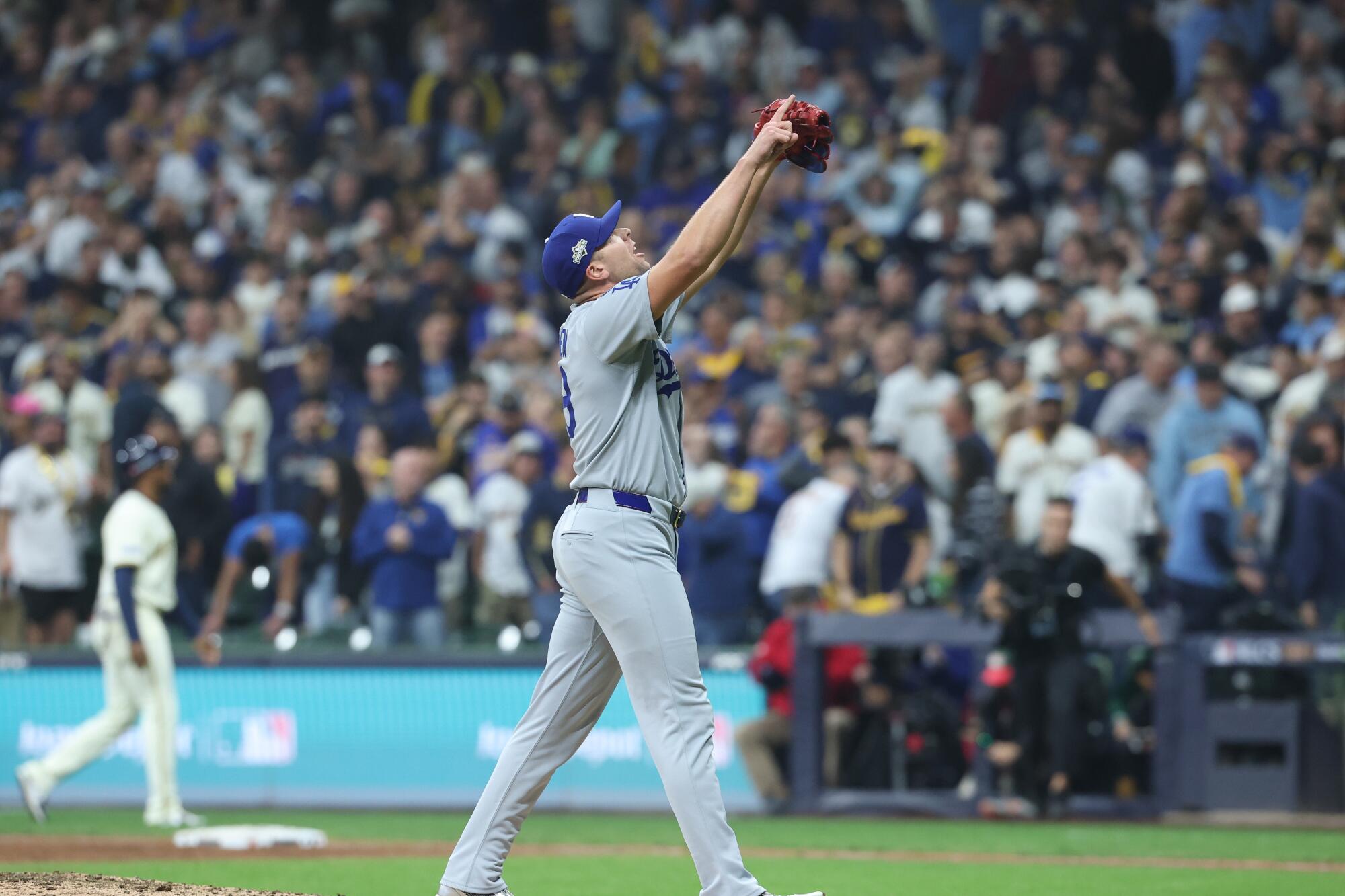 Dodgers pitcher Blake Treinen reacts after striking out Brice Turang for the final out of the Dodgers' 2-1 win.