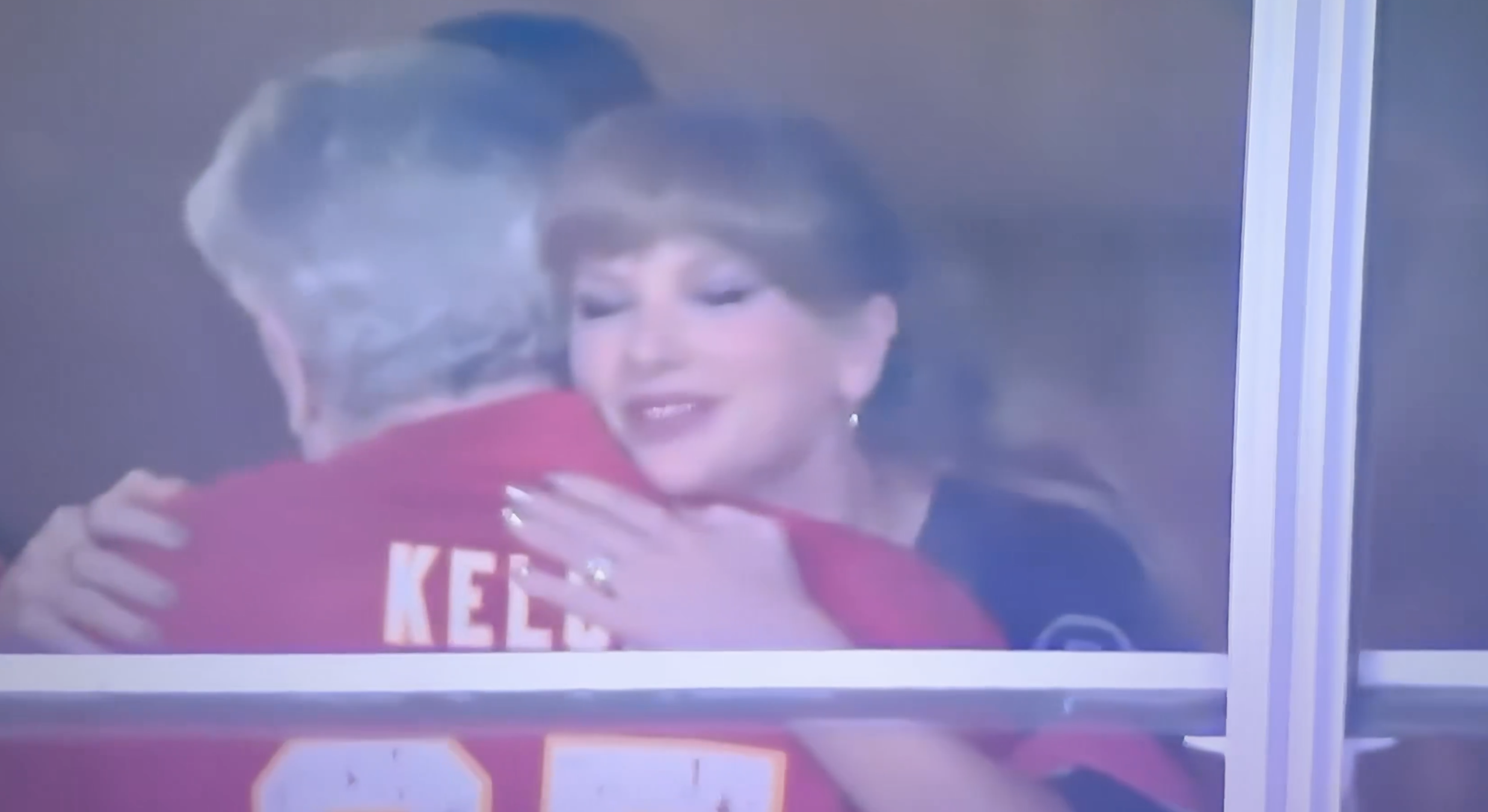 Taylor Swift hugging Caitlin Clark at a Chiefs game.