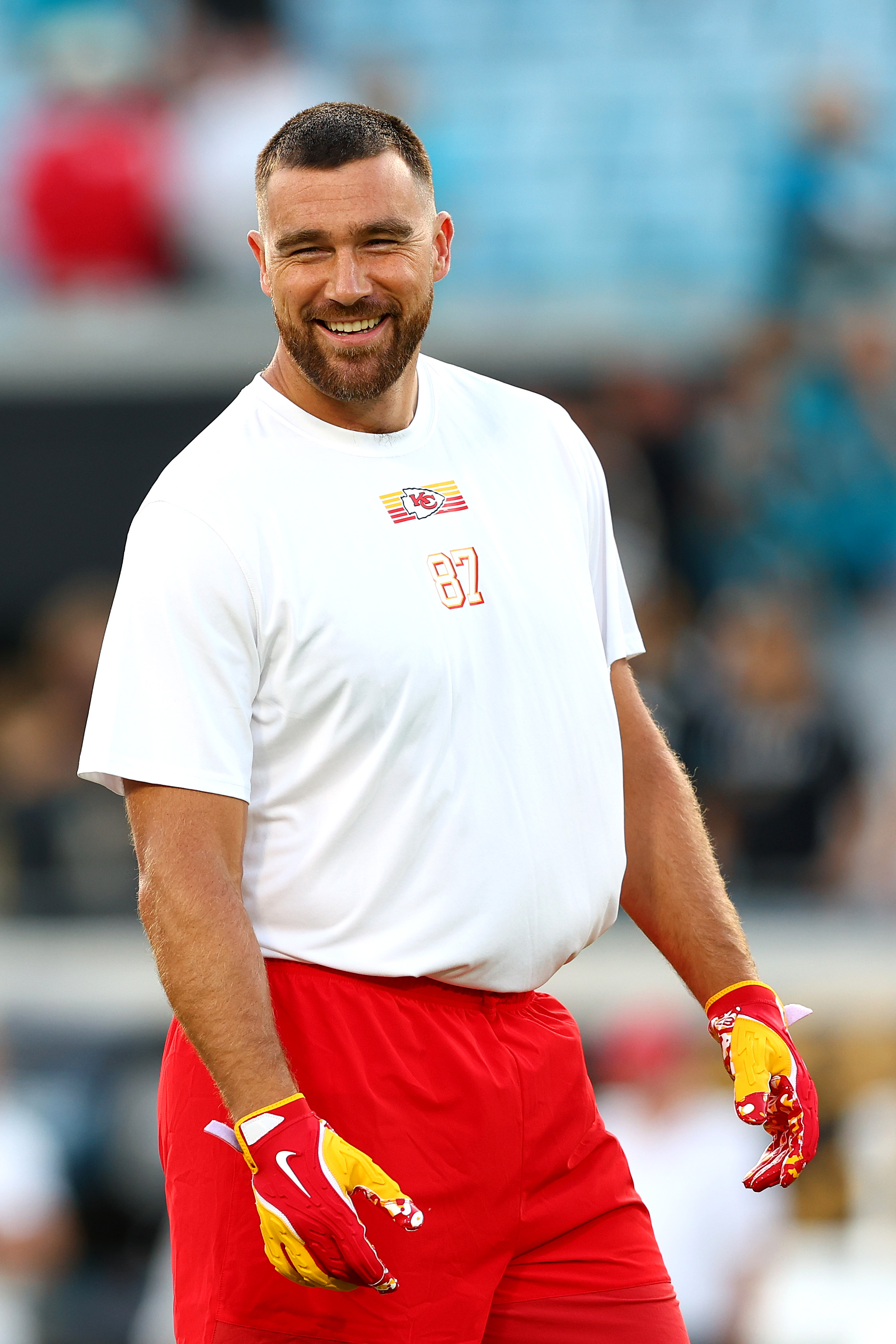 Travis Kelce #87 of the Kansas City Chiefs smiles while warming up.